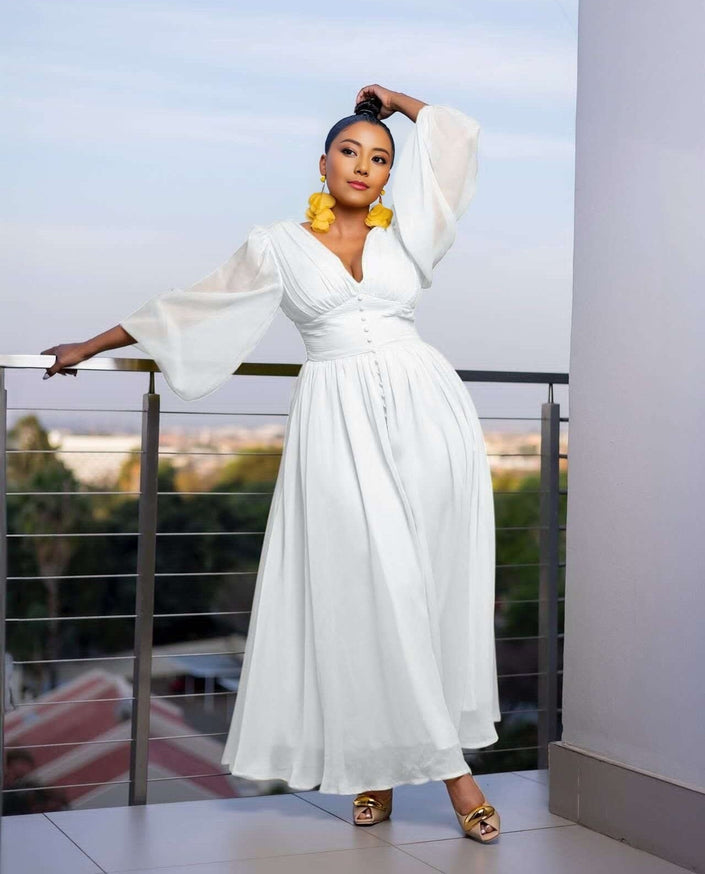 White puff-sleeve maxi evening dress with V-neck bodice and front slit