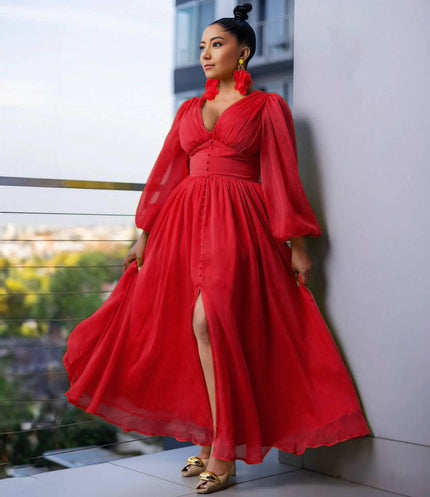 Red maxi evening dress with puff sleeves, V-neck bodice, and front slit