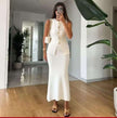 White sleeveless knit cardigan set with button front and matching long skirt