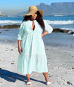 Light turquoise tiered maxi dress with V-neck and three-quarter sleeves