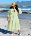 Light green tiered maxi dress with V-neck and three-quarter sleeves