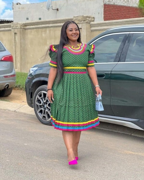 Green puff-sleeve midi dress with multicolor patterned yoke and trim