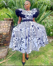 Geometric midi dress with puff sleeves and navy-and-white statement print