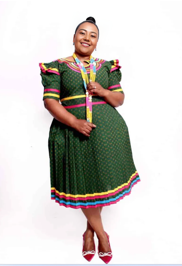 Green puff-sleeve midi dress with rainbow collar, yoke, and hem trim
