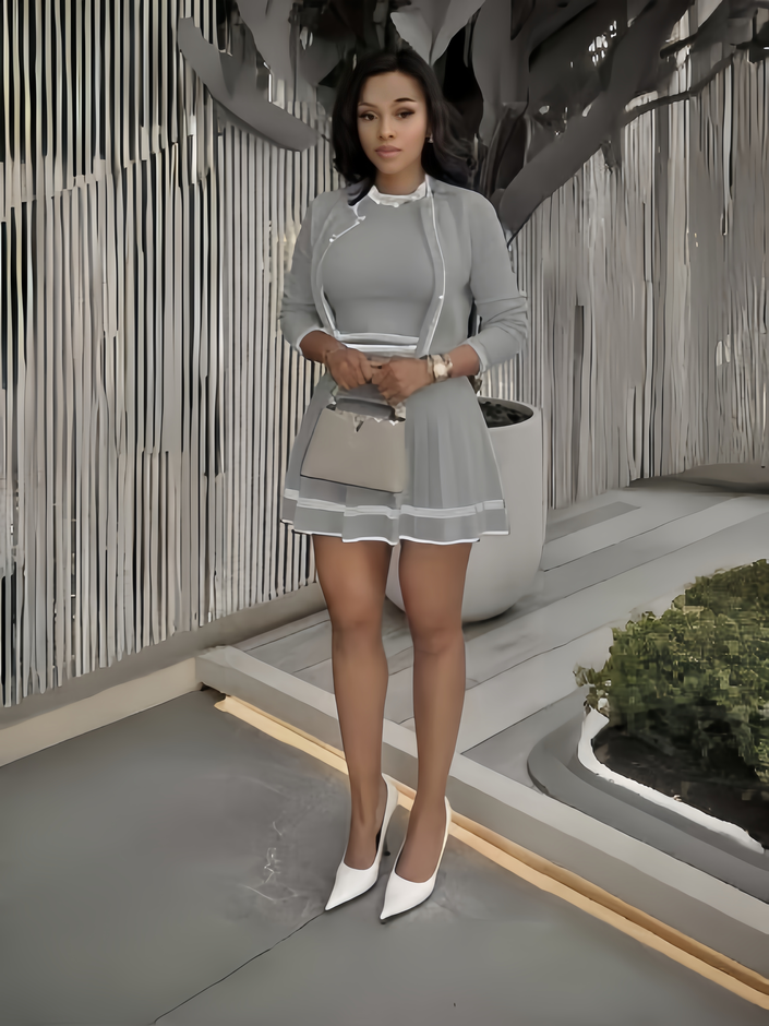 Grey knit cropped jacket and mini skirt set with white trim and scalloped hem