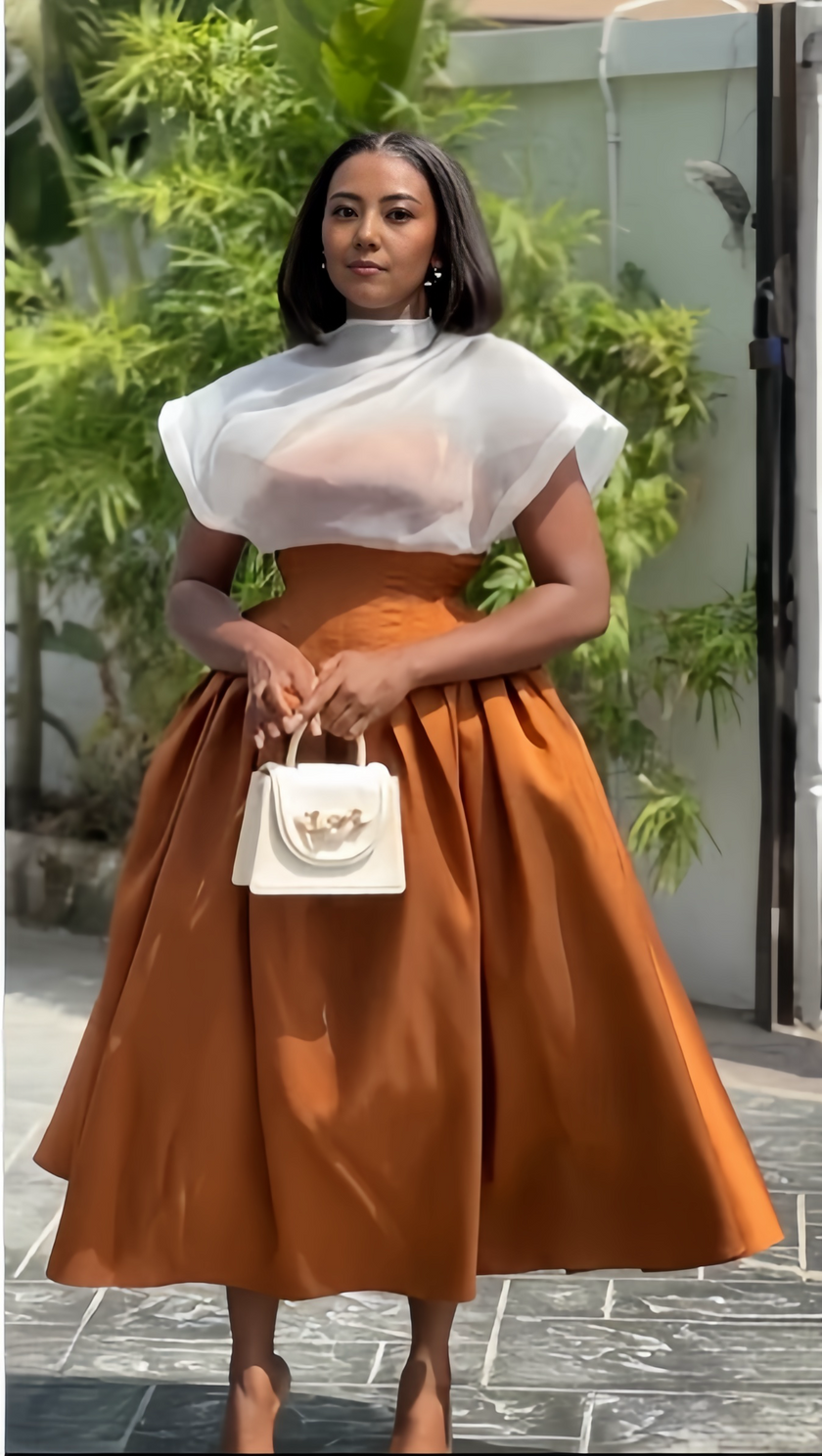 Sheer white twin set: high-neck puff-sleeve top with pleated brown midi skirt