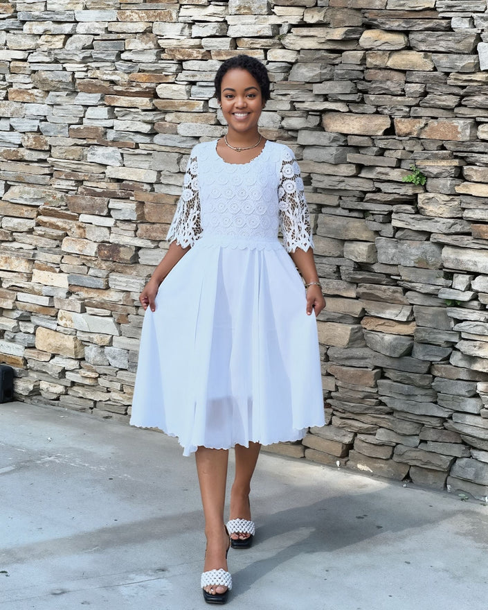 White lace midi dress with textured fit-and-flare bodice and 3/4 lace sleeves