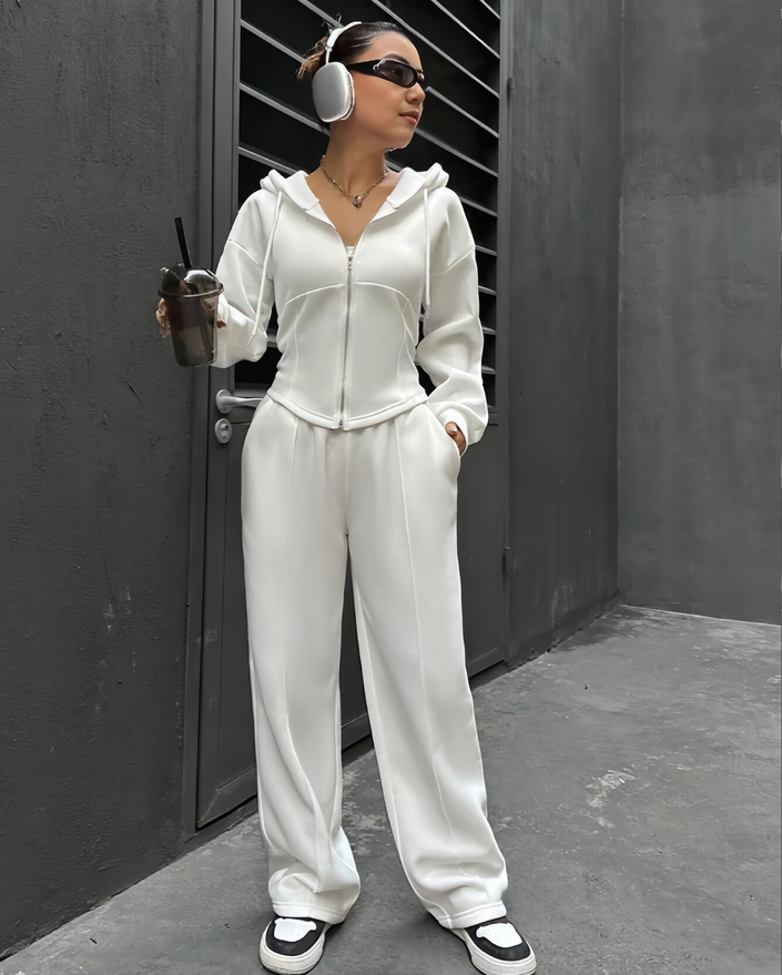 White hooded zip hoodie and relaxed jogger pants set, wide-leg fit.