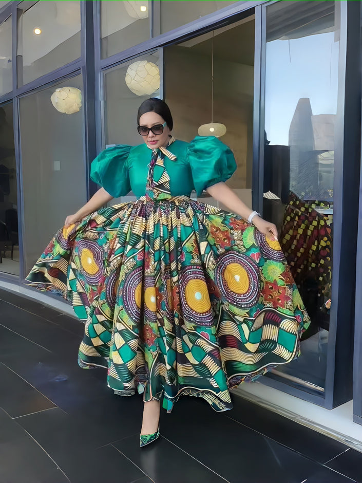 Green patterned maxi dress with puff sleeves and full skirt