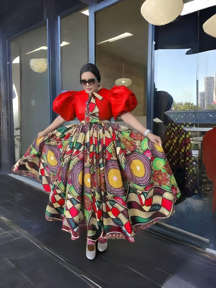 Red patterned maxi dress with puff sleeves and full skirt