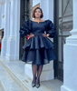 Black puff-sleeve layered dress with ruffled sleeves and V-neck
