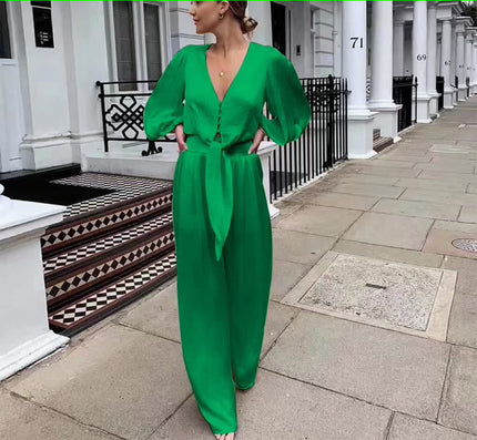 Green V-neck jumpsuit with puff sleeves and adjustable waist tie, long wide legs
