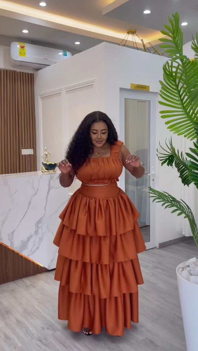 Brown ruffle tiered maxi dress with smocked bodice and off-shoulder sleeves