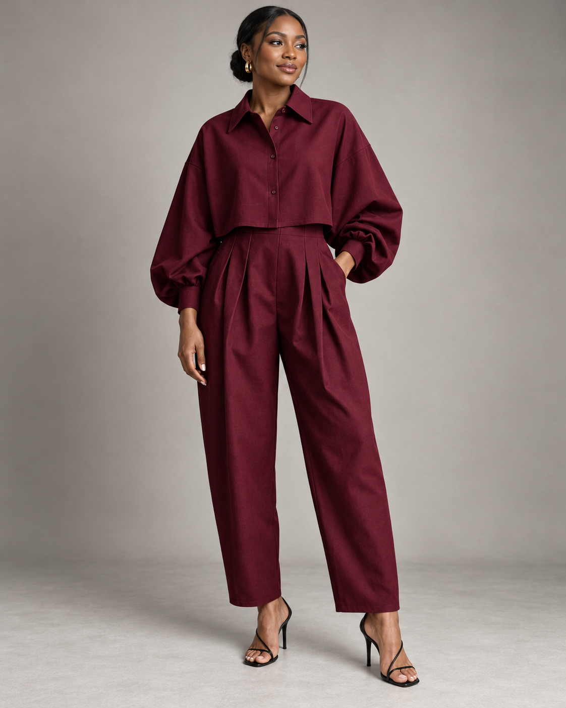Maroon two-piece set with balloon-sleeve cropped button shirt and pleated trousers