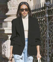 Black blazer jacket with notched lapels and patch pockets, cuffed sleeves