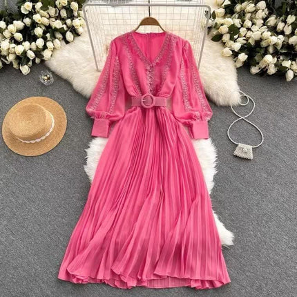 Pink pleated maxi dress, V-neck, long sleeves, waist belt with oval buckle