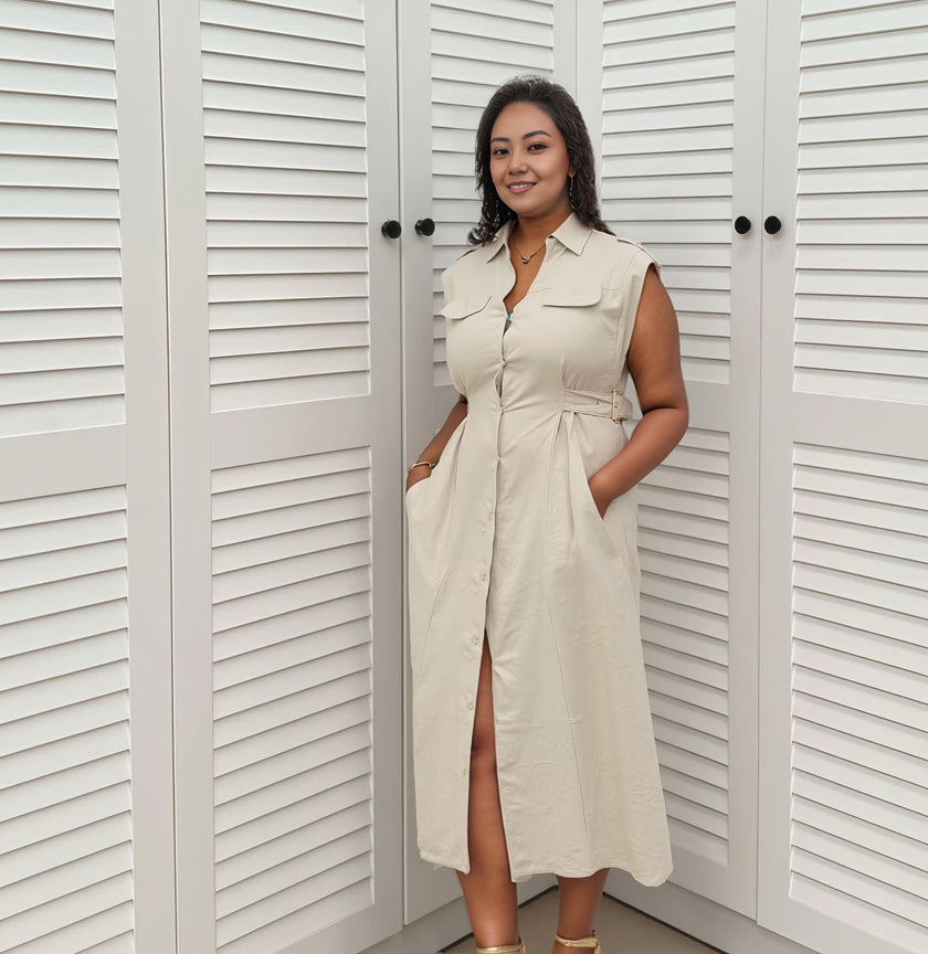 Sleeveless midi shirt dress in light khaki with flap pockets, button front, and slit