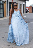 Light blue floral maxi dress with spaghetti straps, sleeveless, flowing skirt