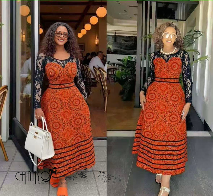 African print maxi dress with lace bodice, long dark sleeves, orange-red geometric pattern
