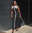 Sleeveless slim-fit midi dress in black with white front placket and buttons