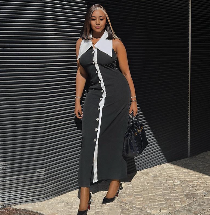 Sleeveless slim-fit midi dress in black with white front placket and buttons