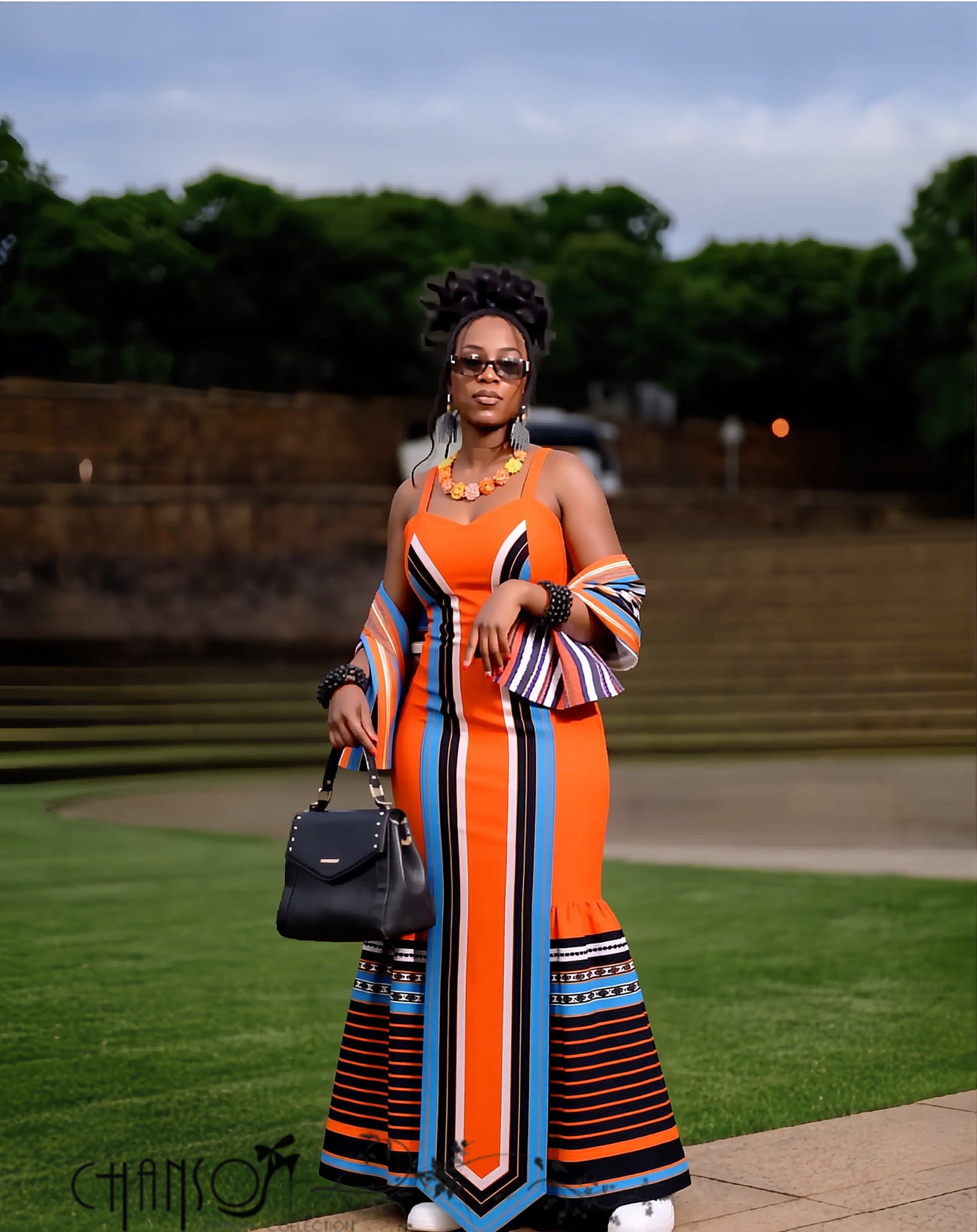 Vibrant striped orange African traditional maxi dress for women