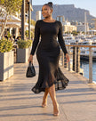 Black ribbed midi dress with long sleeves and a sheer mermaid hem