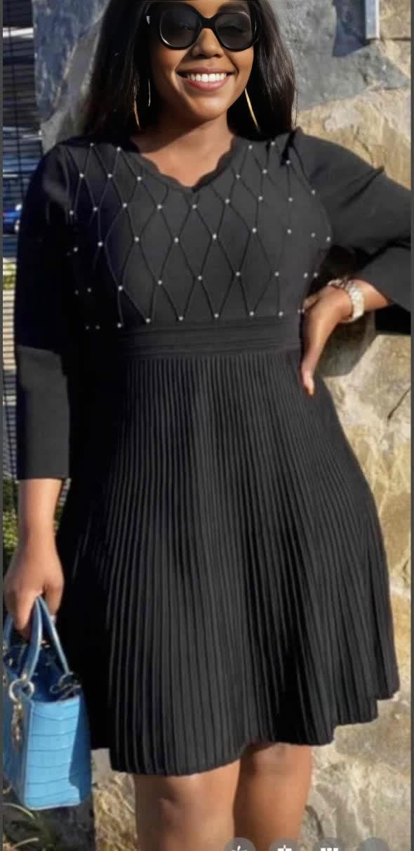 Knit midi dress with pleated skirt and bead-studded V neckline, dark knit