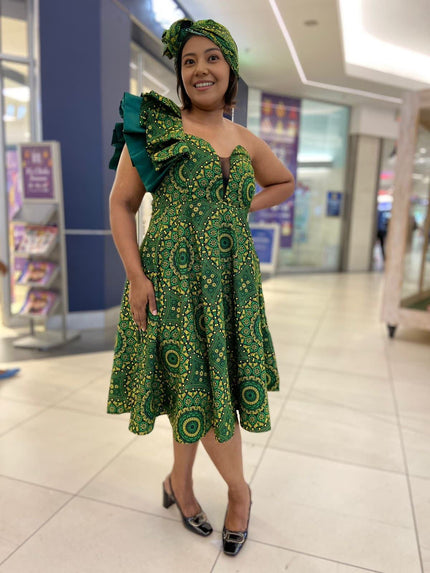 Dark-green one-shoulder ruffle midi dress with repeating circular motifs