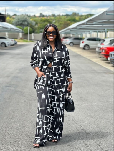 Printed twin set, black-and-white check shirt and wide-leg trousers