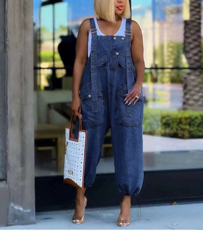 Denim jumpsuit with adjustable straps, front pockets, and wide-leg cut