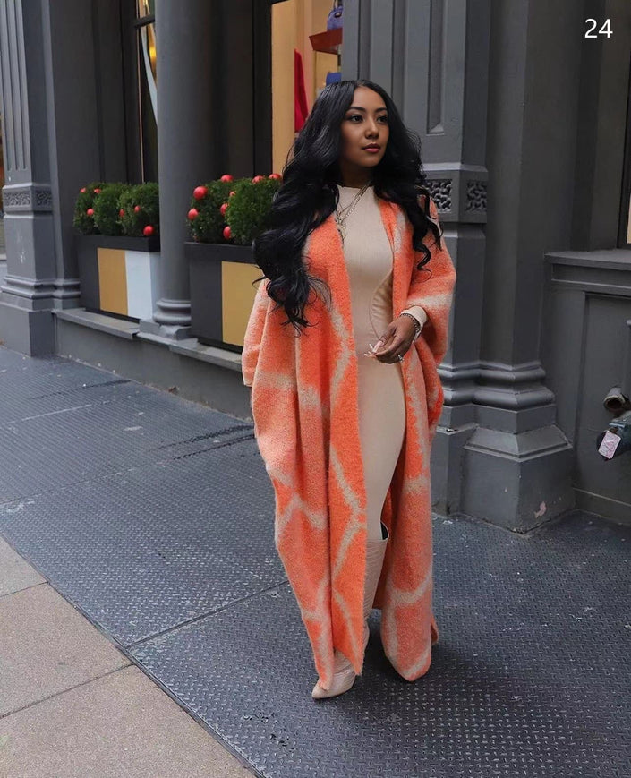Orange-red oversized shawl coat with soft geometric knit, open front