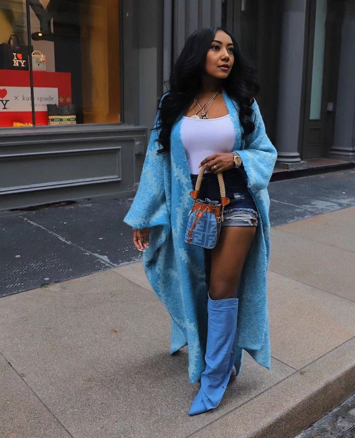 Sky-blue oversized shawl coat with long open drape and soft fuzzy knit texture