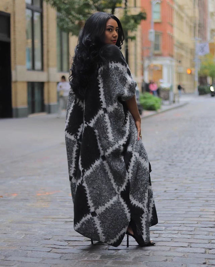 Black oversized shawl coat with gray geometric knit pattern, open drape front