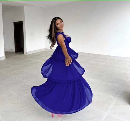 Blue tiered ruffle maxi dress with sweetheart neckline and sleeveless layered skirt.