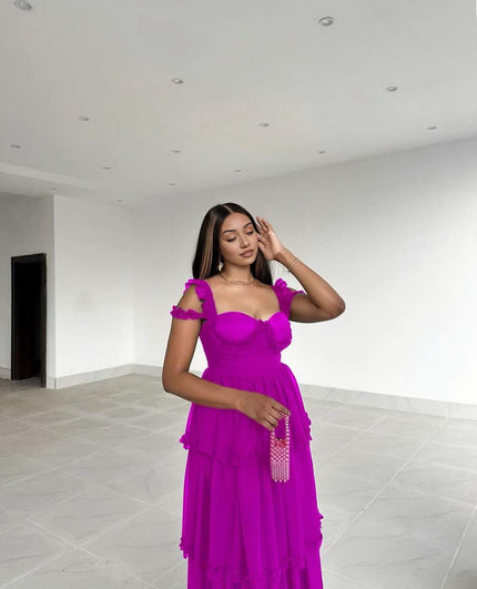 Purple tiered ruffle maxi dress with sweetheart neckline and sleeveless shoulder ruffles.