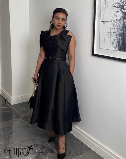 Black bow-neck midi dress with wide bow detail and waist belt, fit-and-flare