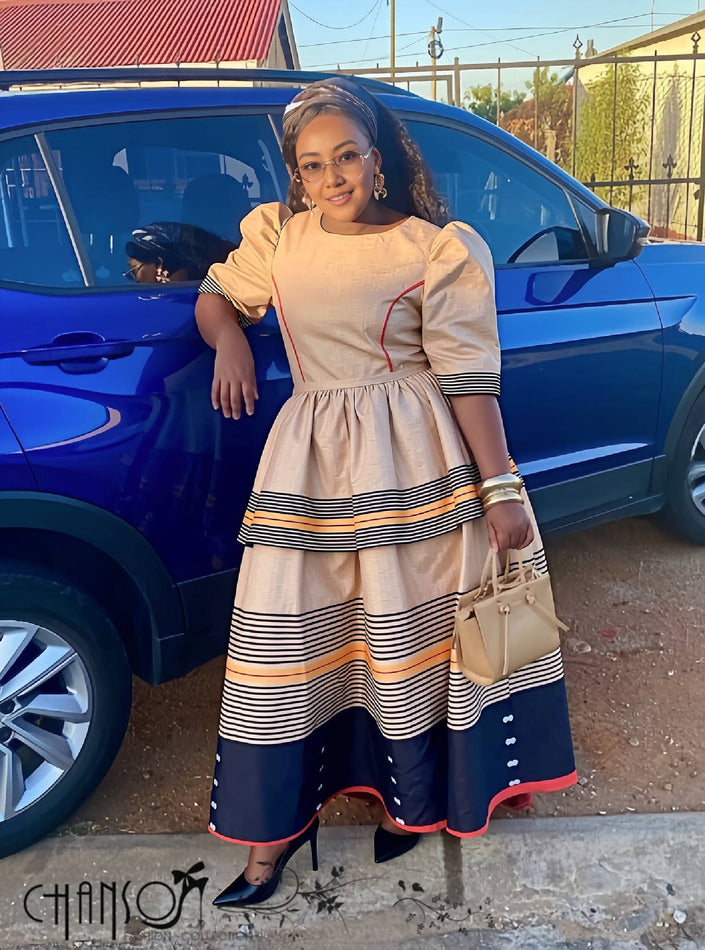 Cream and navy striped midi dress with puff sleeves, gathered waist, tiered flared skirt
