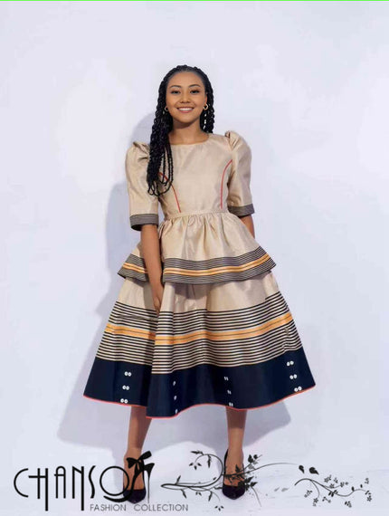 Heritage midi dress with puff sleeves, striped tiered skirt, navy and beige tones