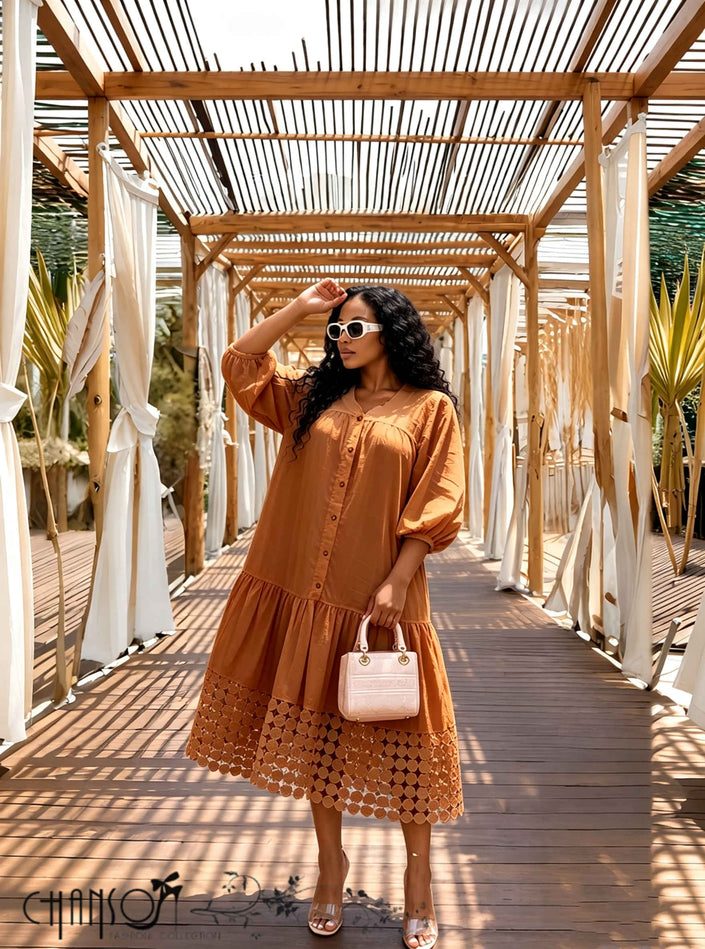 Rust midi shirt dress with puff three-quarter sleeves and lace cutout hem