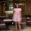 Pink button-front mini dress with gold-tone buttons and cap sleeves