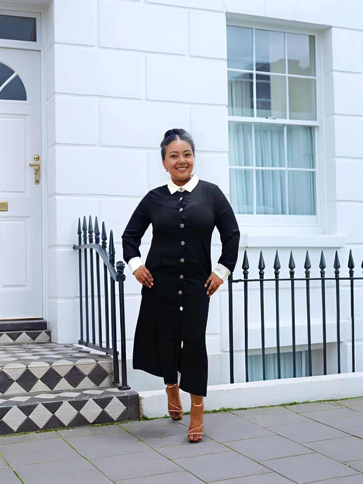 Black midi dress with white contrast collar and button front, long sleeves