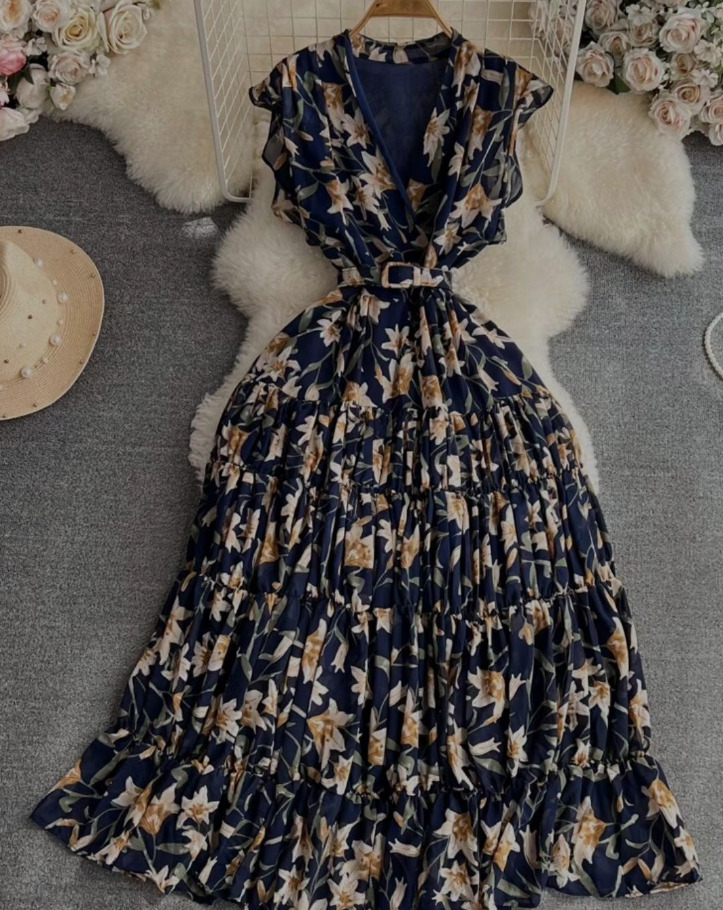 Navy-blue floral midi dress with ruched short sleeves and tied waist belt
