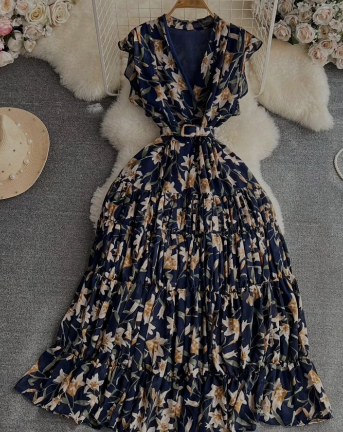 Navy-blue floral midi dress with ruched short sleeves and tied waist belt
