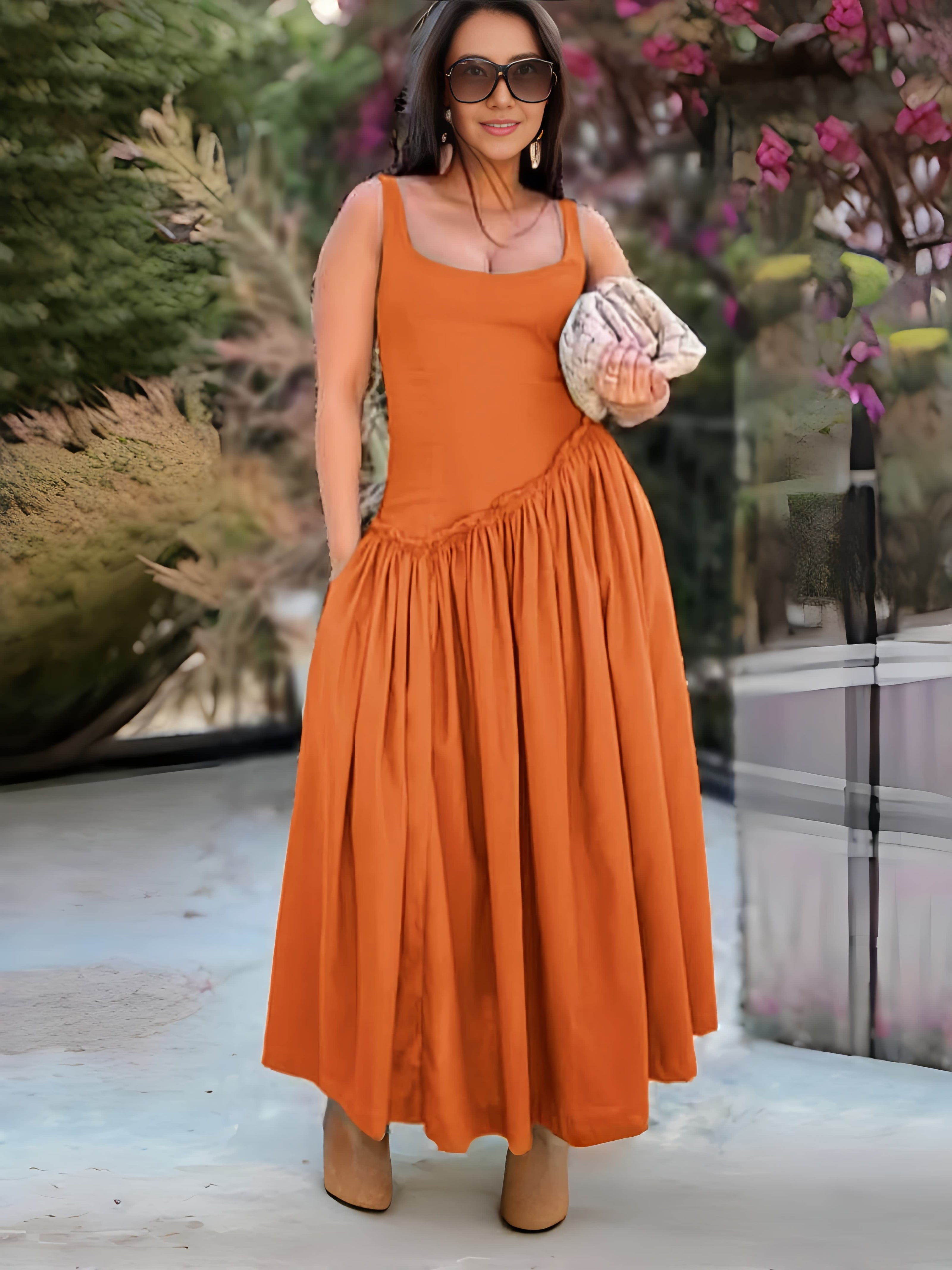 Orange sleeveless maxi dress with square neckline and gathered ruched skirt
