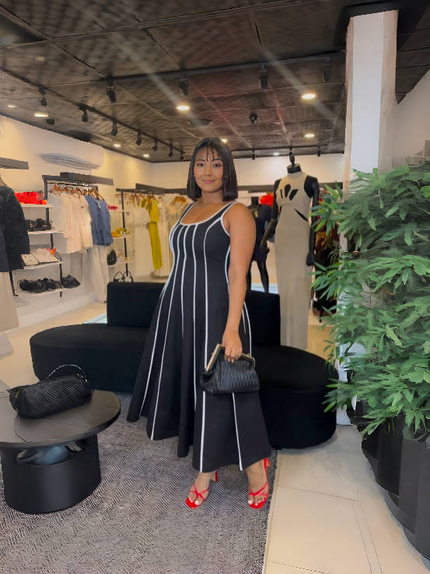 Black striped sleeveless maxi dress with square neckline and vertical lines