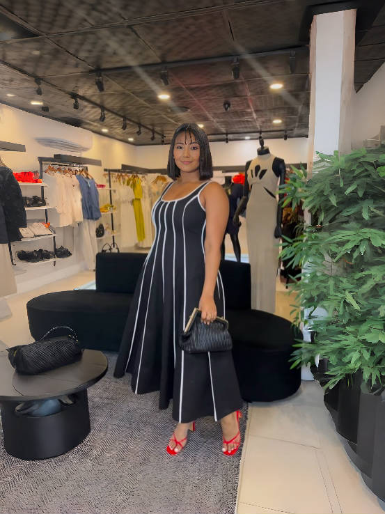 Black striped sleeveless maxi dress with square neckline and vertical lines
