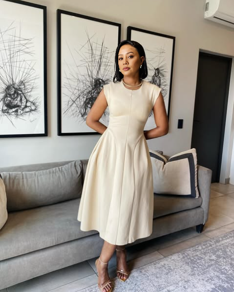 Beige sleeveless A-line midi dress with pleated skirt