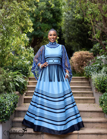 Blue traditional dress with striped skirt and beaded cape sleeves