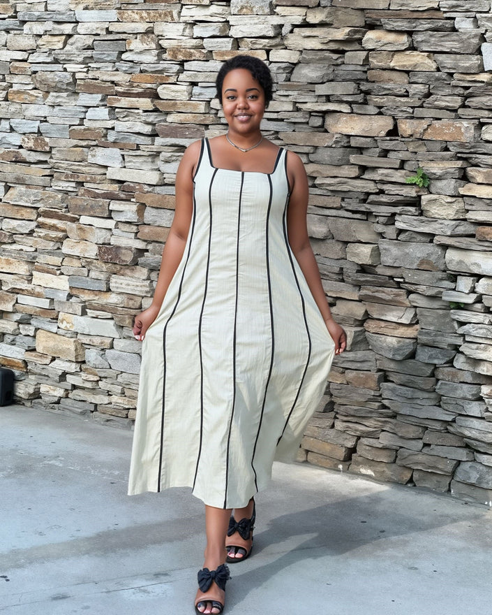 Cream striped sleeveless midi dress with square neckline and vertical seam details